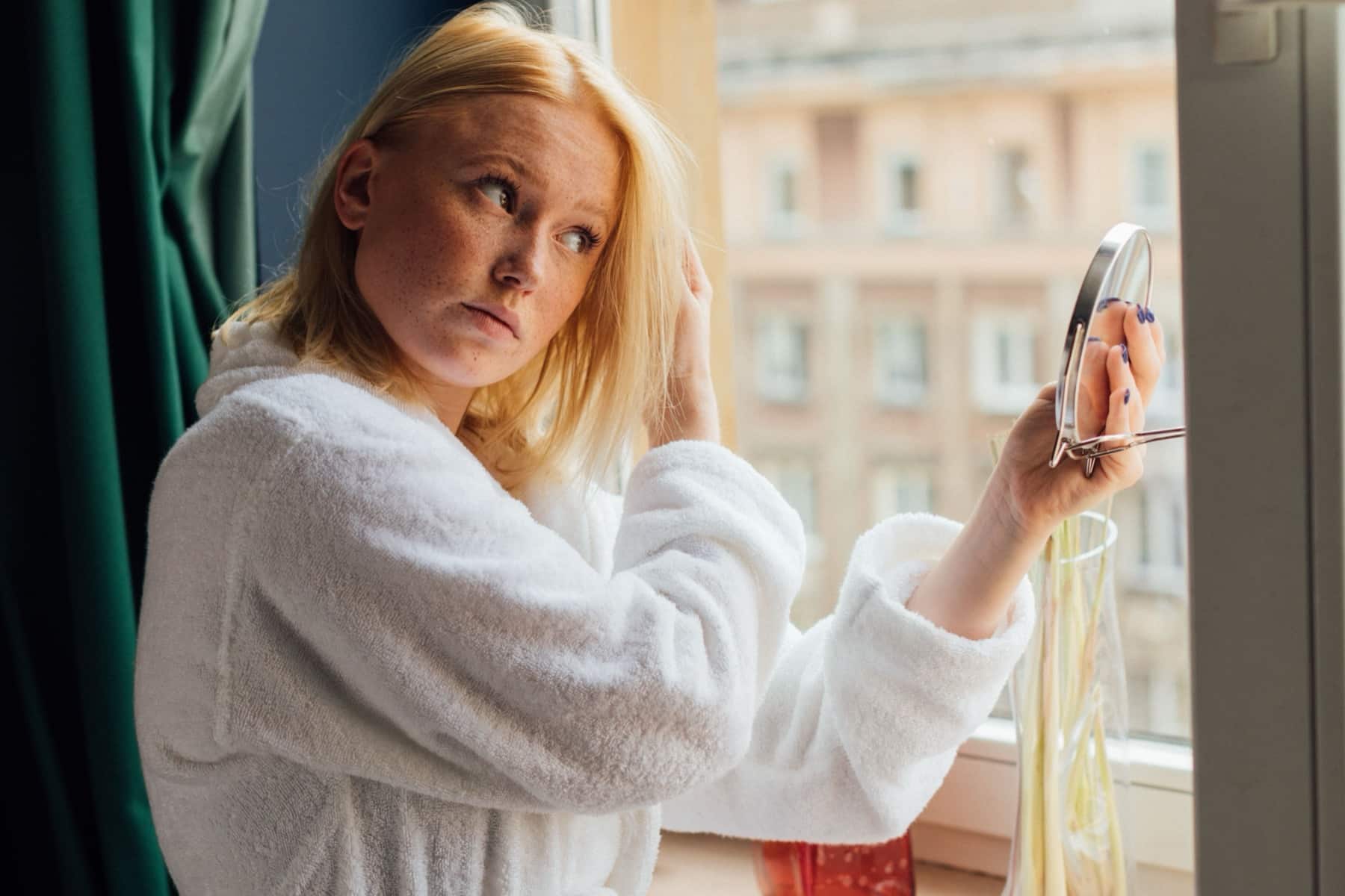 Woman looking in a mirror